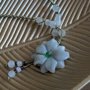 hand-carved natural Type A Burmese jadeite flower pendant necklace on an adjusta